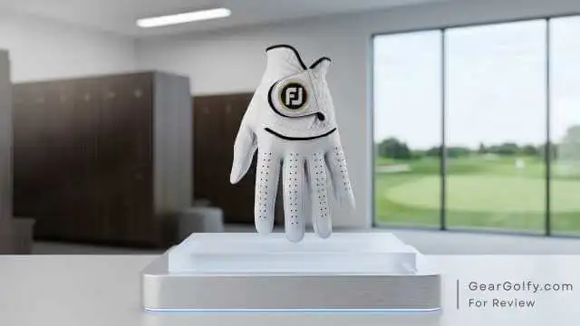 FootJoy StaSof white Cabretta leather golf glove positioned on a display stand.