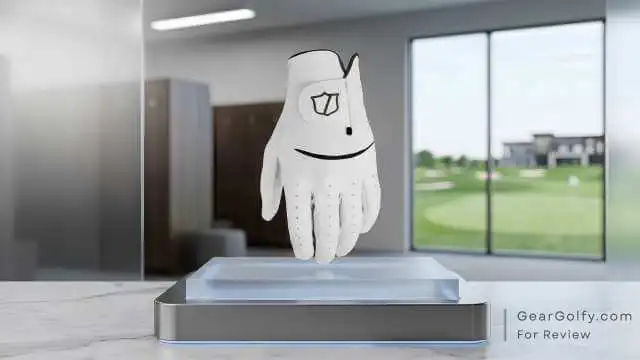 Wilson Staff Model pre-curved Cabretta golf glove positioned on a display stand.
